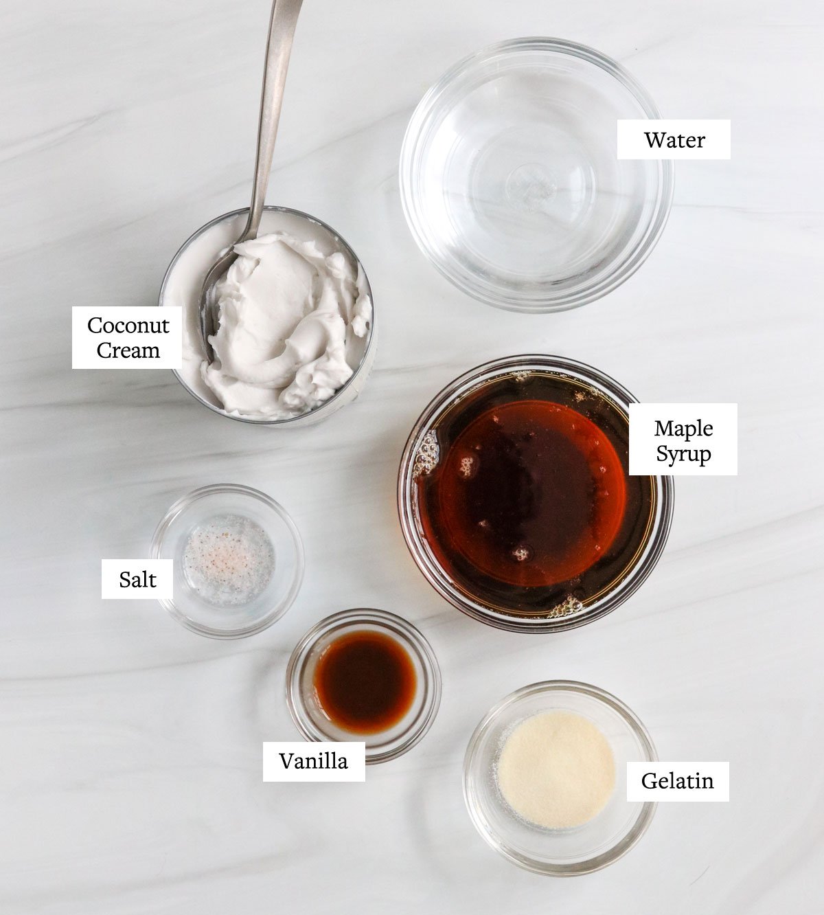 coconut panna cotta ingredients in glass bowls.