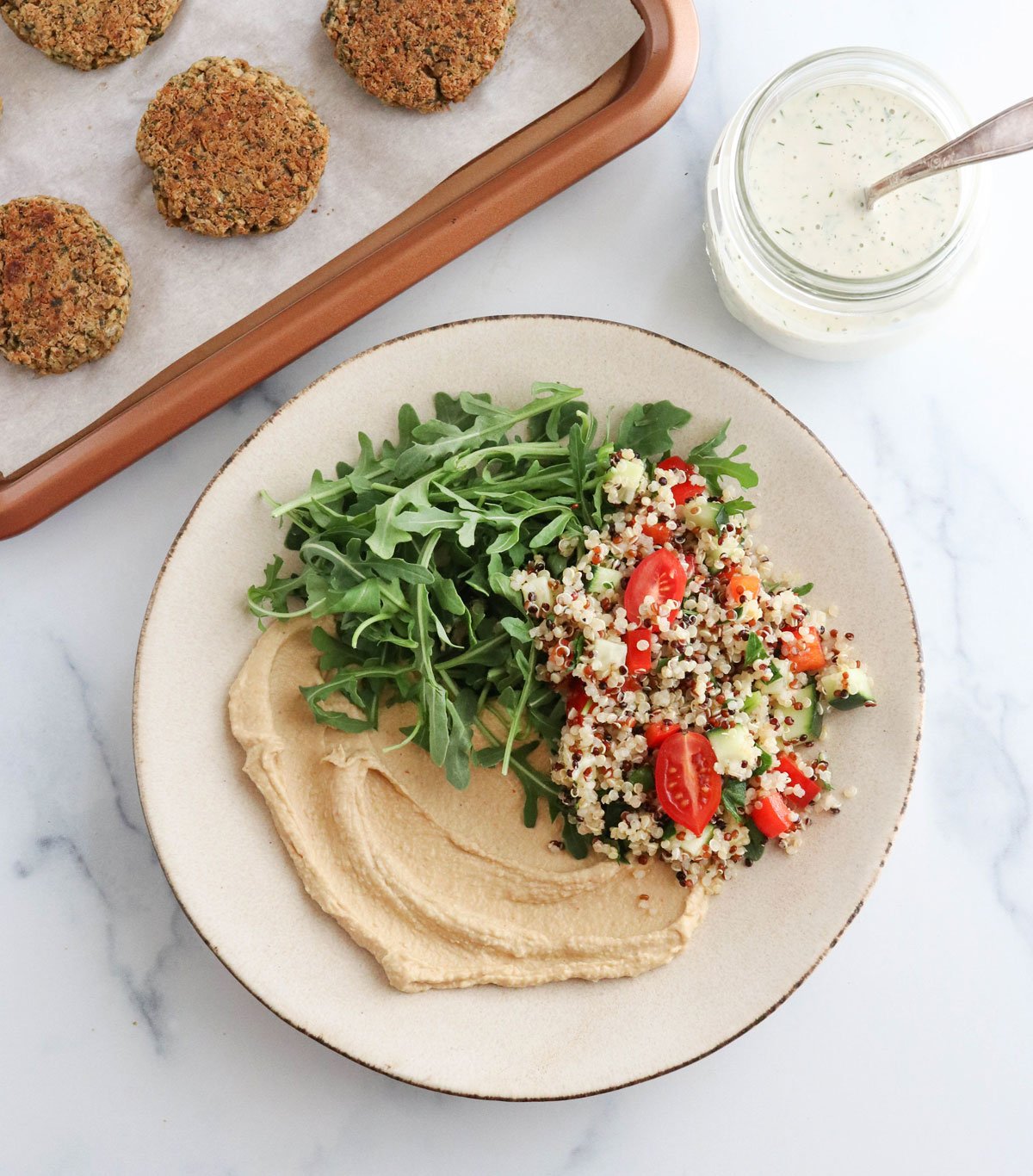 falafel bowl components added to large plate