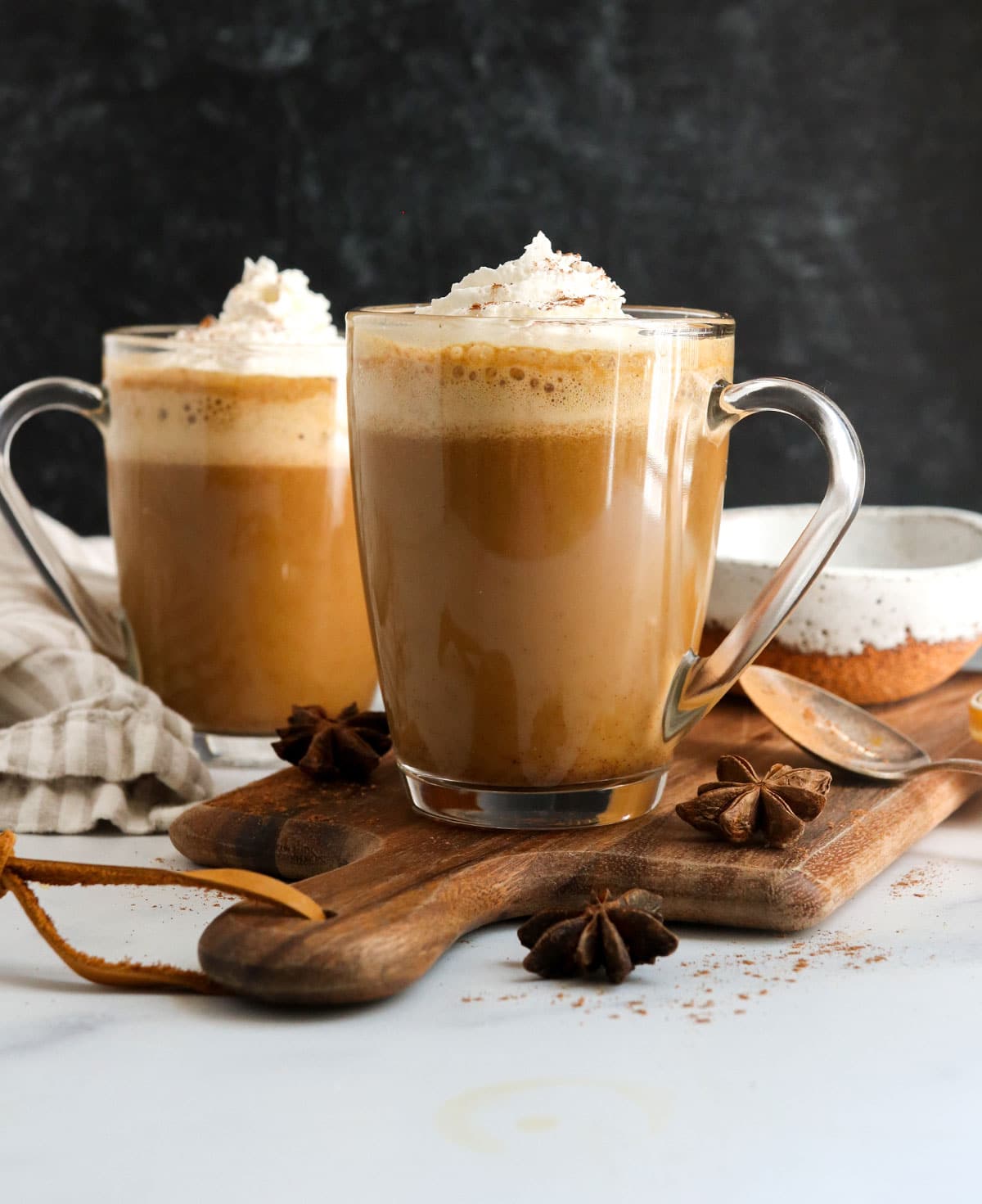 pumpkin spice latte in 2 glasses with black background