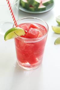 watermelon ice cubes in glass of water
